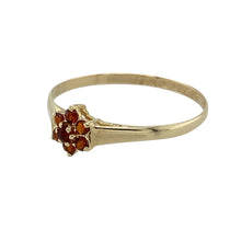 Load image into Gallery viewer, Bring vibrant elegance to your collection with this pre-owned 9ct yellow gold and garnet set flower cluster ring, offering a delicate and colourful design perfect for special occasions or everyday beauty.

Design: The ring features a charming flower cluster design, centred with deep red garnet stones that create a warm and timeless look.
Material: Made from 9-carat yellow gold, the polished finish enhances the rich tones of both the gold and the garnet stones.
