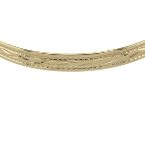 Bring sweet elegance to a little one's collection with this pre-owned 9ct yellow gold patterned children's expanding bangle, offering a timeless keepsake perfect for special occasions or everyday wear.

Design: The bangle features a classic expanding design with delicate engraved patterning, blending charm and tradition in a piece made to grow with its wearer.
Material: Made from 9-carat yellow gold, the polished finish enhances the soft glow of the gold and highlights the detailed surface design.
