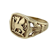Load image into Gallery viewer, Bring bold heritage to your collection with this pre-owned 9ct yellow gold Welsh Dragon signet ring, offering a powerful design rich in national symbolism—perfect for those who value tradition and striking detail.

Design: The ring features a prominent Welsh Dragon on the face, symbolising strength and pride, with Three Feathers emblems on the shoulders to further honour Welsh heritage.

