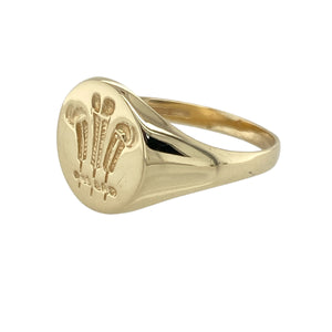 Bring proud tradition to your collection with this pre-owned 9ct yellow gold Welsh Three Feathers oval signet ring, offering classic style with cultural significance—perfect for everyday wear or meaningful gifting.

Design: The oval-shaped face features the iconic Welsh Three Feathers emblem, symbolising loyalty and heritage in a refined and timeless form.
Material: Made from 9-carat yellow gold, the polished finish enhances the detailed engraving and adds a warm, elegant glow.
