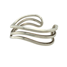 Load image into Gallery viewer, Bring sculptural elegance to your collection with this pre-owned 925 silver three band wave cuff bangle, offering a bold yet fluid design that combines modern style with timeless silver craftsmanship.

Design: The cuff features three flowing, wave-like bands that create a layered, openwork structure—offering movement, texture, and a distinctive silhouette.
Material: Made from 925 sterling silver, the polished finish enhances the fluid curves and gives the bangle a radiant, high-shine appearance.

