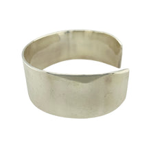Load image into Gallery viewer, Bring bold simplicity to your collection with this pre-owned 925 silver plain cuff bangle, offering a clean, modern design with striking presence—perfect for everyday style or statement layering.

Design: The wide, open cuff design features a smooth, unadorned surface, creating a minimalist yet powerful look that suits any wardrobe.
Material: Made from 925 sterling silver, the high-polish finish enhances the mirror-like shine and showcases the quality of the solid silver.


