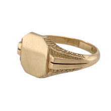 Load image into Gallery viewer, Bring refined distinction to your collection with this pre-owned 9ct yellow gold signet ring, featuring a plain face and patterned shoulders—perfect for everyday sophistication or personalised engraving.

Design: The ring offers a smooth, plain oval face ideal for engraving, complemented by decorative detailing on the shoulders that adds character and visual interest.
Material: Made from 9-carat yellow/rosey gold, the polished finish enhances the warm blush tone
