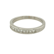 Load image into Gallery viewer, Bring refined sparkle to your collection with this pre-owned 18ct white gold diamond set band ring, offering clean lines and contemporary elegance—perfect for everyday luxury or meaningful milestones.

Design: The front of the band features a row of princess cut diamonds totalling approximately 0.25 carats, set in a sleek channel setting for a modern, seamless look.
Material: Made from 18-carat white gold, the polished finish enhances the crisp brilliance of the diamonds and adds a bright
