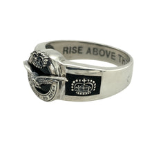 Load image into Gallery viewer, Bring heritage and honour to your collection with this pre-owned 925 silver and onyx set RAF 90th Anniversary ring, commemorating a proud legacy with striking detail and meaningful inscriptions—perfect for collectors or those with a connection to the Royal Air Force.

Design: The front of the ring features a deep black onyx stone set with a central bird emblem and crown, framed by the Latin motto Per Ardua Ad Astra—&quot;Through adversity to the stars.&quot;
