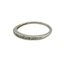 Load image into Gallery viewer, Bring subtle sparkle and refined luxury to your collection with this pre-owned platinum and diamond set band ring, featuring a slim, elegant profile with delicate brilliance—perfect for stacking, everyday wear, or marking a special occasion.

Design: The front of the band is set with diamonds totalling approximately 0.10 carats, adding a touch of sparkle to its clean and classic silhouette.

