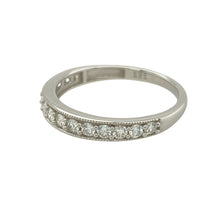 Load image into Gallery viewer, Bring refined brilliance to your collection with this pre-owned 9ct white gold diamond set band ring, featuring sleek styling and a generous diamond presence—perfect for wedding, anniversary, or everyday elegance.

Design: The front of the band is set with approximately 0.44 carats of sparkling diamonds, arranged across a 3mm wide band for a continuous, eye-catching display of brilliance.
Material: Made from 9-carat white gold, the polished finish enhances the clean, modern look
