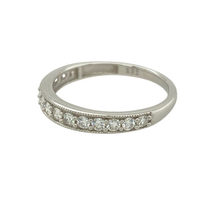 Bring refined brilliance to your collection with this pre-owned 9ct white gold diamond set band ring, featuring sleek styling and a generous diamond presence—perfect for wedding, anniversary, or everyday elegance.

Design: The front of the band is set with approximately 0.44 carats of sparkling diamonds, arranged across a 3mm wide band for a continuous, eye-catching display of brilliance.
Material: Made from 9-carat white gold, the polished finish enhances the clean, modern look