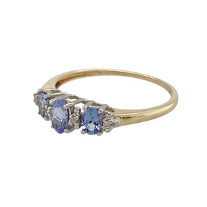 Bring vibrant colour and refined sparkle to your collection with this pre-owned 9ct yellow gold diamond and tanzanite set ring, offering elegant contrast and timeless charm—perfect for special occasions or meaningful gifting.

Design: The ring features a central tanzanite stone measuring 5mm by 3mm, accented by sparkling diamonds on either side, creating a graceful and colourful focal point.
Material: Made from 9-carat yellow gold