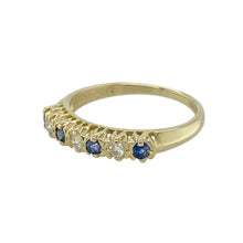 Load image into Gallery viewer, Bring classic contrast and refined sparkle to your collection with this pre-owned 9ct yellow gold diamond and sapphire set band ring, featuring alternating stones in a timeless design—perfect for everyday elegance or a meaningful gift.

Design: The band features a beautiful alternating pattern of four round sapphires (2mm each) and three round diamonds, creating a balanced and eye-catching display of deep blue and bright sparkle.
Material: Made from 9-carat yellow gold
