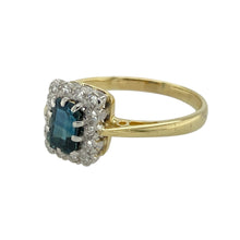 Load image into Gallery viewer, Bring vintage-inspired elegance to your collection with this pre-owned 18ct yellow gold diamond and sapphire set cluster ring, featuring timeless styling and refined sparkle—perfect for special occasions or classic everyday wear.

Design: At the centre sits a 6mm by 4mm rectangular sapphire, surrounded by a halo of brilliant-cut diamonds in a vintage-style cluster setting, offering rich colour and delicate brilliance.
