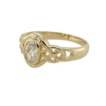Load image into Gallery viewer, Bring graceful sparkle and symbolic charm to your collection with this pre-owned 9ct yellow gold cubic zirconia set oval knot ring, featuring elegant detailing and classic brilliance—perfect for everyday style or meaningful gifting.

Design: The ring showcases a 6mm by 4mm oval-cut cubic zirconia at the centre, framed by a flowing knot design that symbolises unity and continuity.

