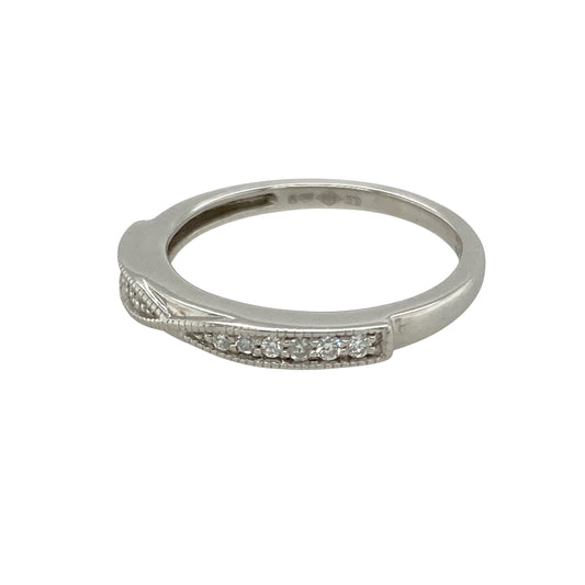 Add subtle sparkle and modern refinement to your jewellery collection with this pre-owned platinum diamond twist band ring—sleek, elegant, and perfect for everyday luxury.

Design: This ring features a delicate 2mm wide twist band, with diamonds seamlessly woven into the curve for a refined and fluid silhouette.
Material: Made from platinum, the cool-toned metal offers a bright, durable setting that enhances the brilliance of the diamonds.

