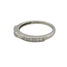 Load image into Gallery viewer, Add subtle sparkle and modern refinement to your jewellery collection with this pre-owned platinum diamond twist band ring—sleek, elegant, and perfect for everyday luxury.

Design: This ring features a delicate 2mm wide twist band, with diamonds seamlessly woven into the curve for a refined and fluid silhouette.
Material: Made from platinum, the cool-toned metal offers a bright, durable setting that enhances the brilliance of the diamonds.

