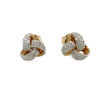 Load image into Gallery viewer, Add timeless charm and symbolic elegance to your collection with these pre-owned 9ct yellow and white gold diamond knot stud earrings—classic design with a hint of sparkle.

Design: These earrings feature an intricate knot motif in a combination of yellow and white gold, symbolising unity and connection. A single diamond sits at the centre of each stud, offering a touch of brilliance.
