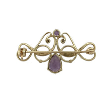 Load image into Gallery viewer, Add vintage-inspired charm and a touch of colour to your collection with this pre-owned 9ct yellow gold diamond and amethyst swirl brooch—a graceful accent piece with timeless appeal.

Design: This elegant brooch features a 9mm by 6mm teardrop-shaped amethyst as the focal point, embraced by a flowing gold swirl accented with a single diamond for subtle sparkle.
Material: Made from 9-carat yellow gold, the warm tone beautifully complements the rich purple hue of the amethyst and the glint of the diamond.

