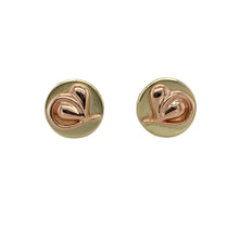 Load image into Gallery viewer, Embrace heritage and elegance with these pre-owned 9ct yellow and rose gold Clogau Tree of Life round stud earrings—a timeless design rooted in symbolism and natural beauty.

Design: These round stud earrings feature the signature Tree of Life motif, blending flowing leaf and vine patterns in a harmonious mix of yellow and rose gold.
Material: Made from 9-carat yellow and rose gold, the contrasting tones highlight the intricate design while offering a warm, elegant finish.

