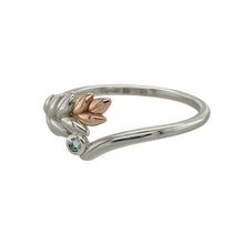 Load image into Gallery viewer, Embrace nature-inspired elegance with this pre-owned 925 silver and 9ct rose Clogau gold aquamarine wishbone leaf ring—a delicate design blending soft tones, symbolic shape, and gentle sparkle.

Design: The ring features a graceful wishbone shape accented with a detailed leaf motif and a 2mm round aquamarine stone at the centre. The front of the ring measures 8mm high, creating a subtle yet eye-catching profile.

