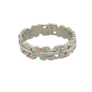 Celebrate heritage and natural beauty with this pre-owned 925 silver and 9ct rose gold Clogau Tree of Life band ring—a symbolic design with timeless elegance and depth.

Design: This 6mm wide band features the iconic Tree of Life motif in flowing vine and leaf patterns, elegantly highlighted with 9ct rose gold detailing.
Material: Made from sterling silver with accents of 9-carat rose gold, the mixed-metal design reflects the harmony and richness of nature.
