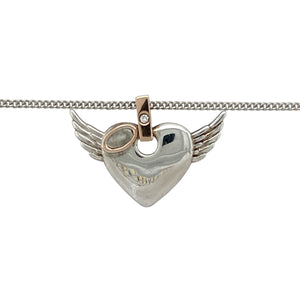 Bring a touch of grace and gentle sparkle to your collection with this pre-owned 925 silver and 9ct rose gold Clogau Angel Heart pendant necklace—an elegant blend of sentiment, beauty, and subtle brilliance.

Design: The pendant features a delicate heart shape with angelic wing-inspired detailing in 9ct rose gold. Measuring 1.6cm long including the bail, it includes a small diamond set within the bail for a touch of refined sparkle.
