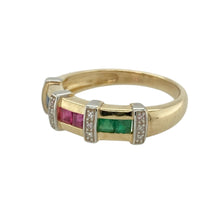 Load image into Gallery viewer, Bring vibrant colour and classic charm to your collection with this pre-owned 9ct yellow gold gemstone and diamond band ring—an eye-catching blend of precious stones and timeless sparkle.

Design: The 5mm wide band features a beautifully arranged sequence of ruby, emerald, sapphire, and diamond sections. Each gemstone is set in its own panel, with glittering diamonds in between to enhance contrast and brilliance.

