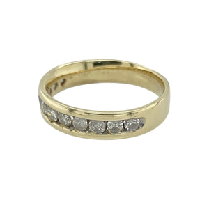 Add refined sparkle and classic style to your collection with this pre-owned 9ct yellow gold diamond band ring—a timeless design with elegant brilliance.

Design: The band measures 4mm wide at the front and features a row of sparkling diamonds set across the top for a sleek, polished look.
Material: Made from 9-carat yellow gold, the warm tone enhances the brilliance of the diamonds and offers a traditional, luxurious finish.
