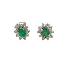 Load image into Gallery viewer, Add a pop of vibrant colour and refined sparkle with these pre-owned 9ct white gold diamond and emerald cluster stud earrings—elegant, timeless, and full of charm.

Design: Each earring features a 4mm by 3mm oval-cut emerald at the centre, surrounded by a halo of brilliant-cut diamonds that enhance the rich green hue and provide a classic cluster look.
Material: Made from 9-carat white gold, the cool-toned setting complements the vivid emeralds and enhances the sparkle of the surrounding diamonds.

