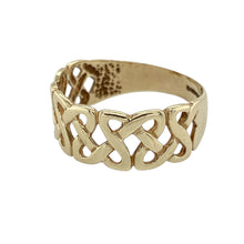 Load image into Gallery viewer, Celebrate heritage and timeless design with this pre-owned 9ct yellow gold Celtic knot band ring—a meaningful symbol of unity and eternity, crafted in elegant detail.

Design: The band features an intricate Celtic knot pattern across the front, measuring 8mm wide, with interwoven lines symbolising eternal love, loyalty, and interconnectedness.
Material: Made from 9-carat yellow gold, the warm finish enhances the traditional motif while offering a classic and enduring look.

