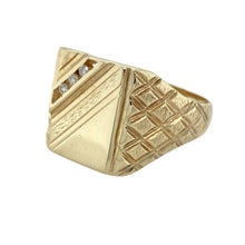Load image into Gallery viewer, Make a bold and refined statement with this pre-owned 9ct yellow gold diamond set square signet ring—a classic design elevated with sparkle and detail.

Design: The ring features a 16mm high square face with three diamonds set diagonally in one corner, adding a touch of brilliance. The shoulders are patterned, enhancing the overall bold and distinguished look.
Material: Made from 9-carat yellow gold, the polished finish adds warmth and shine
