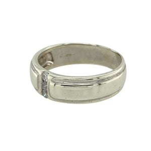 Add modern elegance and subtle sparkle to your collection with this pre-owned 9ct white gold diamond set band ring—a refined design with a sleek, contemporary edge.

Design: This 6mm wide band features three small diamonds set in a vertical line down the centre of the ring, creating a clean, balanced look with understated brilliance.
Material: Made from 9-carat white gold, the cool, polished finish enhances the modern styling and provides a sophisticated backdrop for the diamond accents.
