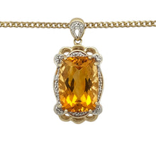 Load image into Gallery viewer, Add warmth and brilliance to your collection with this pre-owned 9ct yellow gold diamond and citrine pendant necklace—a striking blend of golden tones, elegant sparkle, and timeless design.

Design: The pendant features an 18mm by 13mm elongated cushion-cut citrine at the centre, surrounded by a halo of sparkling diamonds for maximum impact. The full pendant measures 3.5cm long including the bail.


