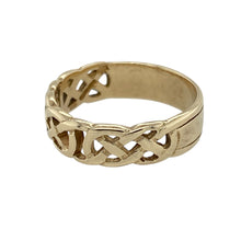 Load image into Gallery viewer, Celebrate tradition and timeless design with this pre-owned 9ct yellow gold Celtic knot band ring—rich in symbolism and beautifully crafted.

Design: This 6mm wide band features an intricate Celtic knot pattern encircling the ring, symbolising eternity, unity, and interconnectedness.
Material: Made from 9-carat yellow gold, the polished finish enhances the detailed knotwork and provides a warm, classic glow.

