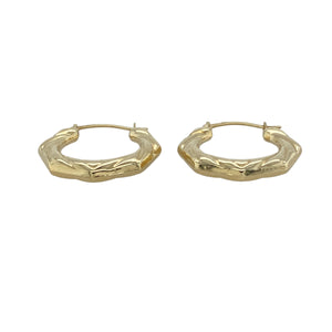 Add charm and character to your everyday look with these pre-owned 9ct yellow gold six-sided patterned creole earrings—sweetly detailed and effortlessly stylish.

Design: Each earring features a six-sided angular creole shape with intricate patterning and a delicate heart accent at the bottom, adding a touch of playful elegance.
Material: Made from 9-carat yellow gold, the polished finish enhances both the geometric form and the subtle heart detail for a warm, timeless glow.
