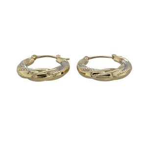 Add elegant movement and contrast to your look with these pre-owned 9ct yellow and white gold patterned twisted hoop creole earrings—timeless with a modern twist.

Design: These creole-style hoops feature a twisted design combining both yellow and white gold, enhanced with fine patterning for added texture and shine.
Material: Made from 9-carat yellow and white gold, the two-tone finish creates a beautiful contrast, offering versatility and refined style.
