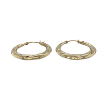 Load image into Gallery viewer, Add subtle texture and timeless style to your jewellery collection with these pre-owned 9ct yellow gold patterned hoop creole earrings—lightweight, elegant, and easy to wear.

Design: These classic creole earrings feature a hoop shape with intricate patterning that adds depth and a touch of vintage-inspired charm.
Material: Made from 9-carat yellow gold, the polished finish enhances the detailed design and provides a warm, traditional glow.

