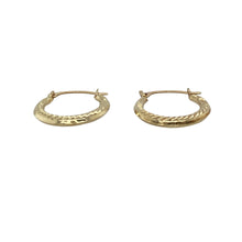 Load image into Gallery viewer, Add a delicate touch of texture and shine with these pre-owned 9ct yellow gold patterned small creole earrings—subtle, stylish, and perfect for everyday wear.

Design: These petite creole earrings feature a classic hoop shape with detailed patterning that adds charm and visual interest to their compact size.
Material: Made from 9-carat yellow gold, the polished finish highlights the fine detailing and delivers a warm, elegant glow.
