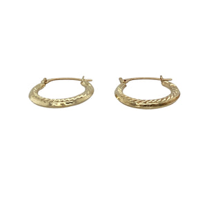 Add a delicate touch of texture and shine with these pre-owned 9ct yellow gold patterned small creole earrings—subtle, stylish, and perfect for everyday wear.

Design: These petite creole earrings feature a classic hoop shape with detailed patterning that adds charm and visual interest to their compact size.
Material: Made from 9-carat yellow gold, the polished finish highlights the fine detailing and delivers a warm, elegant glow.