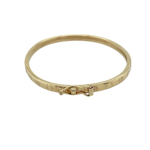 Mark a special moment with this pre-owned 9ct yellow gold heart patterned baby bangle—sweetly detailed and perfect for a cherished keepsake.

Design: This charming bangle features a delicate heart pattern engraved along the band, offering a timeless and sentimental design for little wrists.
Material: Made from 9-carat yellow gold, the polished finish gives the piece a warm, classic glow that enhances the fine detailing.
