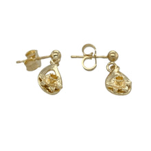 Load image into Gallery viewer, Celebrate Welsh heritage with elegance in these pre-owned 9ct yellow Welsh gold daffodil drop earrings—graceful, symbolic, and full of national pride.

Design: Each earring showcases a finely crafted daffodil—the national flower of Wales—suspended in a delicate drop style for subtle movement and charm.
Material: Made from 9-carat Welsh gold, the polished yellow finish adds a warm, radiant glow and highlights the intricate floral detailing.

