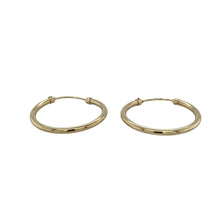 Load image into Gallery viewer, Add everyday elegance to your jewellery collection with these pre-owned 9ct yellow gold plain hoop earrings—classic, lightweight, and effortlessly versatile.

Design: These traditional hoop earrings feature a smooth, polished finish and a simple rounded shape for a timeless, understated look.
Material: Made from 9-carat yellow gold, the bright, warm tone offers a classic shine that pairs perfectly with any outfit.

