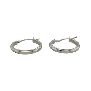 Add sleek sophistication to your jewellery collection with these pre-owned 9ct white gold plain hoop creole earrings—minimalist, versatile, and effortlessly chic.

Design: These classic creole-style hoops feature a smooth, polished surface and clean curved silhouette for a timeless and understated look.
Material: Made from 9-carat white gold, the cool-toned finish offers a modern alternative to yellow gold with a refined, contemporary feel.
