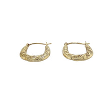 Load image into Gallery viewer, Add delicate detail and classic shine to your collection with these pre-owned 9ct yellow gold patterned oval creole earrings—lightweight, elegant, and timelessly stylish.

Design: These petite oval creole earrings feature fine engraved patterning along the surface, offering subtle texture and vintage-inspired charm in a sleek oval shape.
Material: Made from 9-carat yellow gold, the polished finish enhances the intricate detailing and provides a warm, radiant glow.


