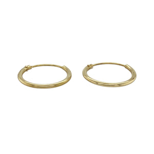 Keep it simple and stylish with these pre-owned 9ct yellow gold plain hoop earrings—delicate, lightweight, and effortlessly versatile.

Design: These classic hoop earrings feature a smooth, polished finish and minimalist round shape, offering timeless appeal in a subtle size.
Material: Made from 9-carat yellow gold, the bright, warm tone adds a touch of everyday elegance.
Earring Detail: Perfect for second piercings, layering, or minimalist styling, these hoops are a go-to essential for any jewellery