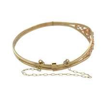 Load image into Gallery viewer, Celebrate heritage and elegance with this pre-owned 9ct yellow and rose gold Clogau Tree of Life bangle—rich in meaning, beautifully detailed, and timeless in design.

Design: The front of the bangle features the iconic Tree of Life motif in a flowing design that symbolises growth, strength, and connection. The front section is 12mm high, offering a bold and graceful presence.

