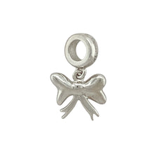 Load image into Gallery viewer, Add a touch of grace and feminine charm to your collection with this pre-owned 925 silver and 9ct rose gold Clogau bow charm—elegant, delicate, and beautifully detailed.

Design: This charming bow-shaped piece features polished sterling silver loops with a soft 9ct Welsh rose gold accent, creating a graceful and timeless two-tone design.
Material: Crafted from 925 sterling silver with rare 9-carat Welsh rose gold detailing, the polished finish enhances the flowing curves and soft contrast.

