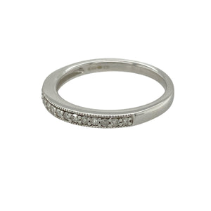 Add refined sparkle and modern elegance to your collection with this pre-owned 9ct white gold and diamond set band ring—sleek, understated, and perfect for stacking or wearing alone.

Design: The band features a row of shimmering diamonds across the 2mm wide front, offering subtle brilliance in a slim, contemporary profile.
Material: Made from 9-carat white gold, the polished finish enhances the clean lines and provides a bright, sophisticated shine.
