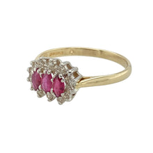 Load image into Gallery viewer, Add romantic colour and vintage-inspired sparkle to your collection with this pre-owned 9ct yellow gold diamond and ruby set trilogy cluster ring—graceful, symbolic, and full of timeless charm.

Design: The ring features three marquise-cut ruby stones, each measuring 4mm by 2mm, arranged in a trilogy style and surrounded by a delicate halo of diamonds for added brilliance.
Material: Made from 9-carat yellow gold, the polished finish enhances the vibrant red of the rubies and the sparkle of the diamonds.


