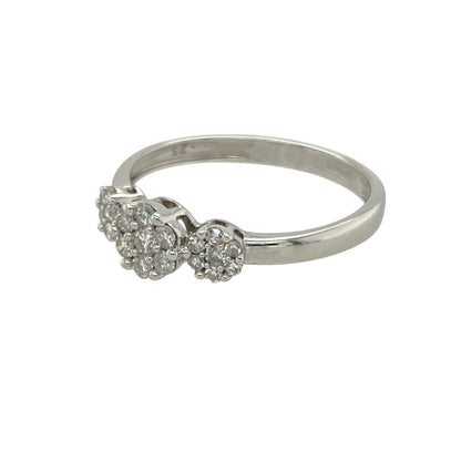 Add elegant sparkle and symbolic design to your collection with this pre-owned 9ct white gold diamond set cluster trilogy ring—refined, meaningful, and perfect for timeless styling.

Design: The ring features three diamond clusters across the 5mm wide front, with the central cluster slightly larger to create a balanced and eye-catching trilogy effect. The total diamond content is approximately 0.25ct.

