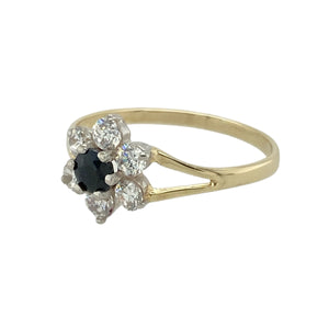 Add delicate sparkle and floral elegance to your collection with this pre-owned 9ct yellow gold sapphire and cubic zirconia set flower cluster ring—charming, feminine, and perfect for everyday wear.

Design: The ring features a 4mm round sapphire at the centre, surrounded by a halo of cubic zirconia stones arranged in a classic flower cluster style for a soft, sparkling finish.
