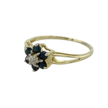 Load image into Gallery viewer, Add classic charm and delicate sparkle to your collection with this pre-owned 9ct yellow gold diamond and sapphire set flower cluster ring—feminine, timeless, and perfect for everyday elegance.

Design: The ring features a flower cluster design with 2mm round sapphire petals surrounding a small central diamond, creating a graceful and balanced floral motif.
Material: Made from 9-carat yellow gold, the polished finish enhances the rich blue of the sapphires and the sparkle of the diamond accent.

